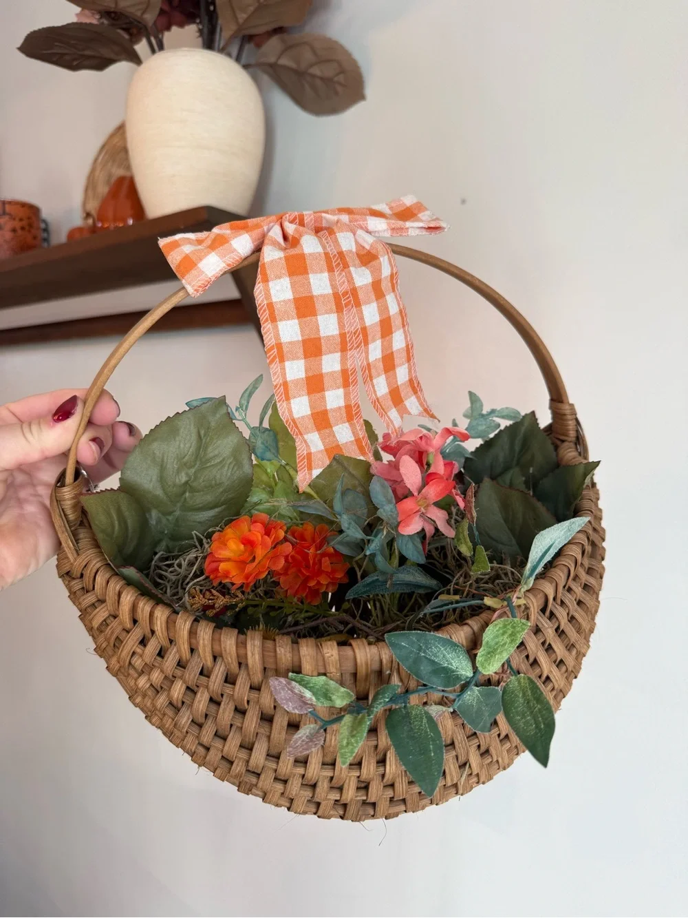 Woven Brown Hanging Basket with Orange Gingham Bow and Faux Floral Accents